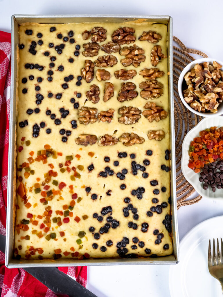 Golden baked sheet pan pancakes with mixed toppings