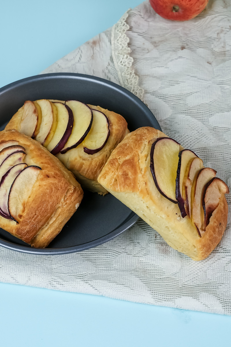 Golden brown Danish pastries with caramelized apples