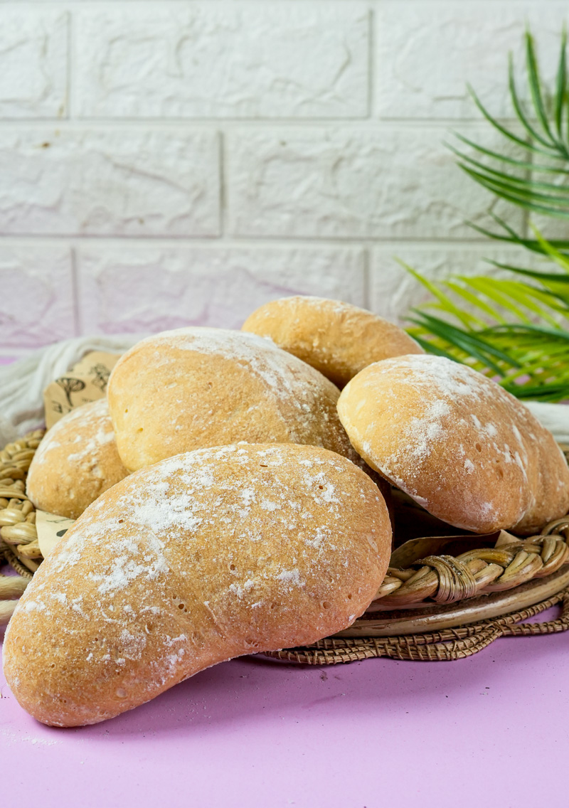 Golden brown ciabatta bread in rustic basket