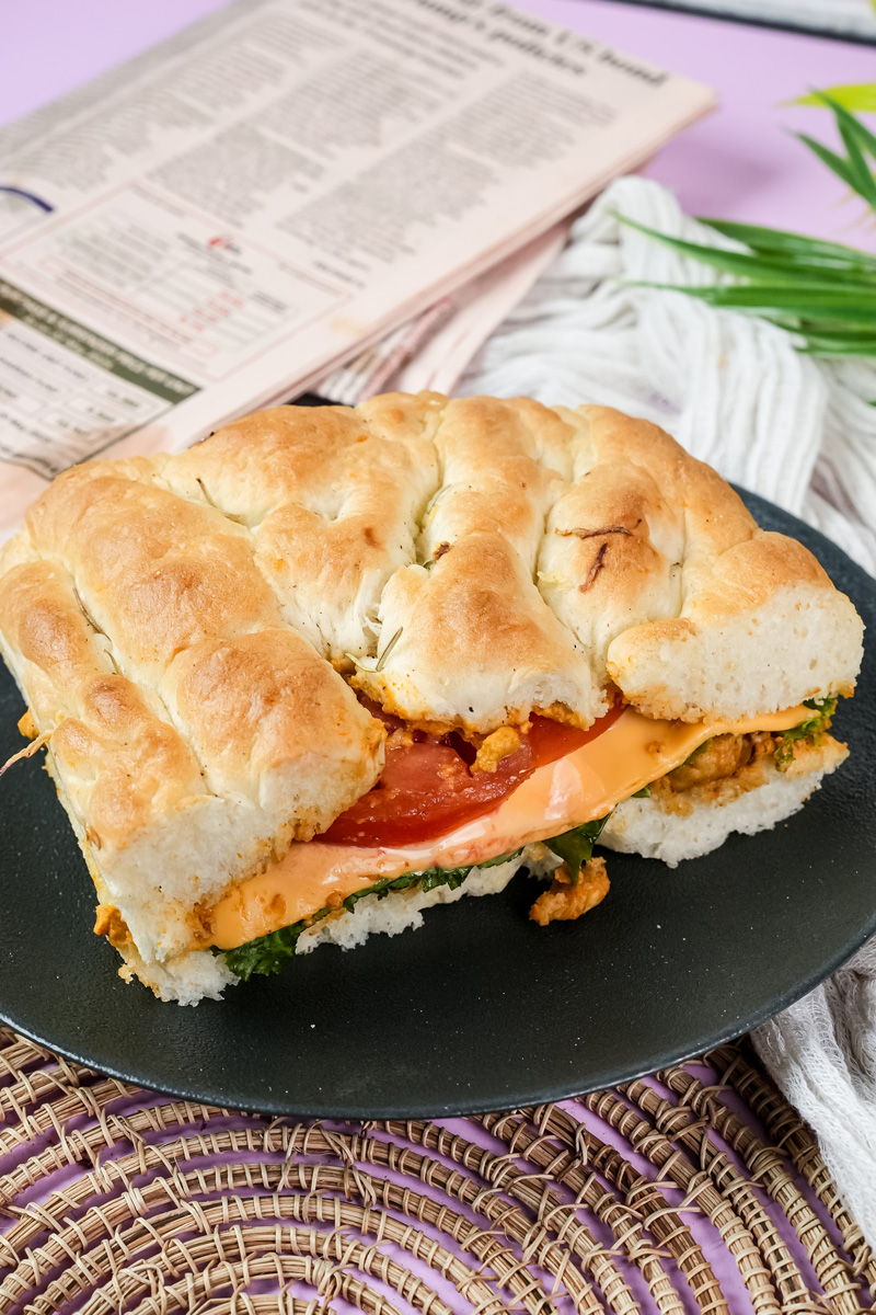 Golden focaccia sandwich with herbs and vegetable fillings