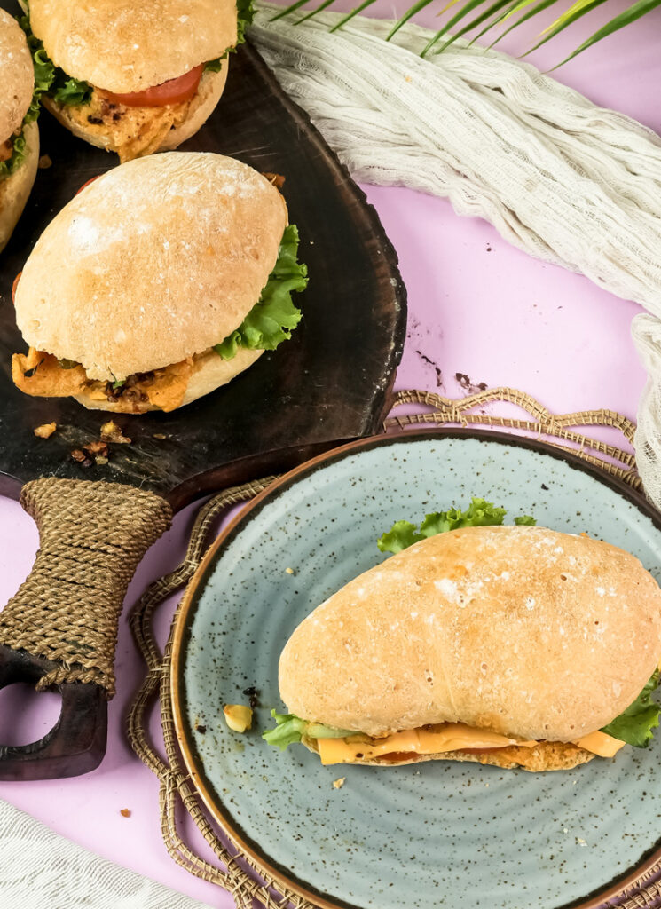 Gourmet ciabatta sandwiches on slate serving board
