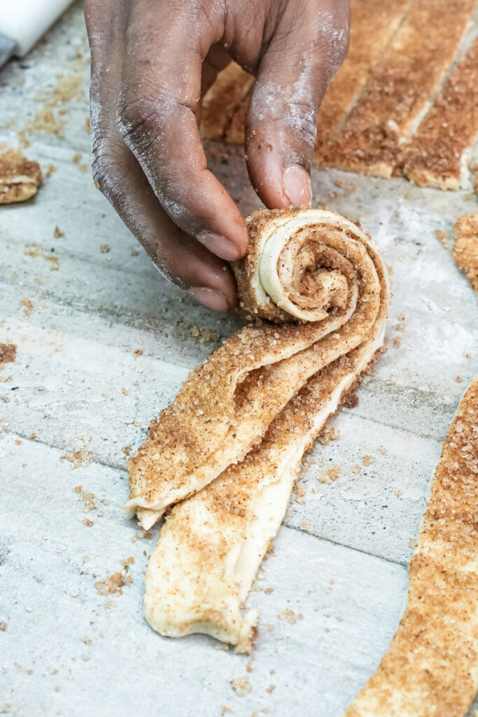 Holding rolled cruffin dough showing spiral pattern