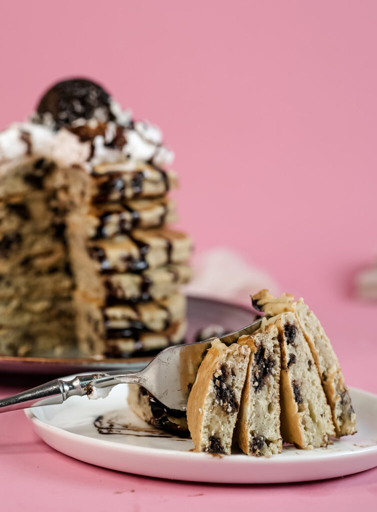 Sliced Oreo pancake stack showing internal cookie pieces and layers