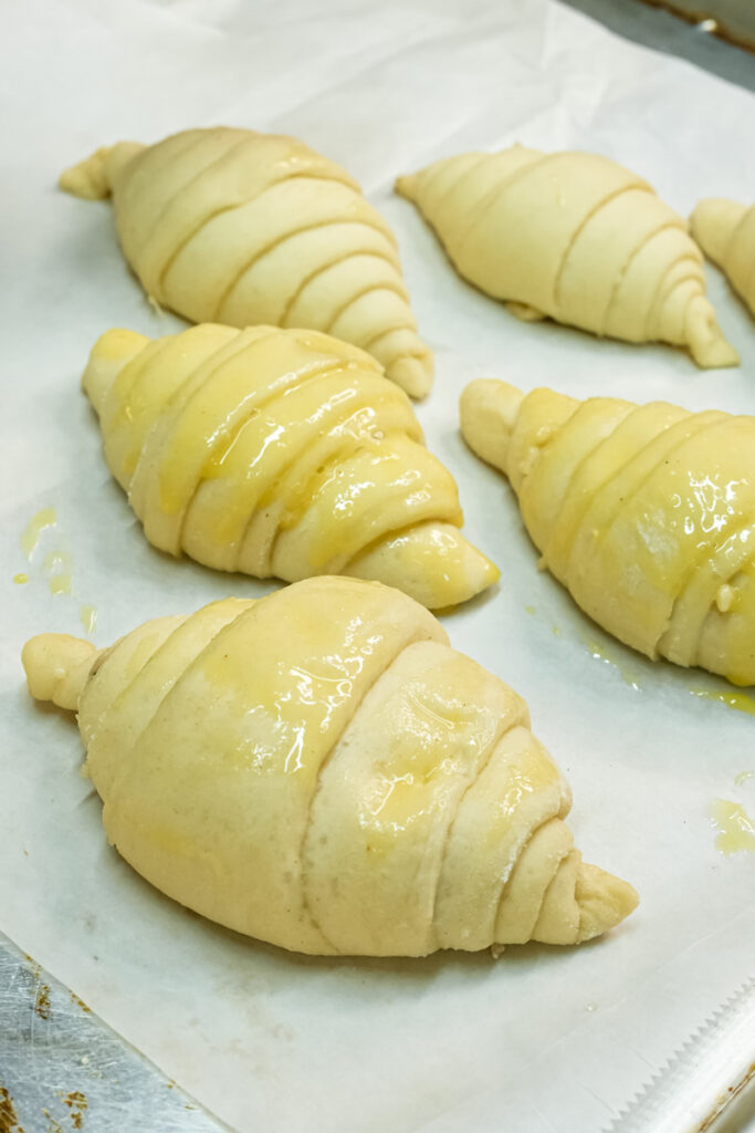 Homemade croissants with egg wash ready for baking