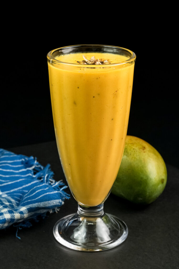 Homemade mango lassi served in tall glass