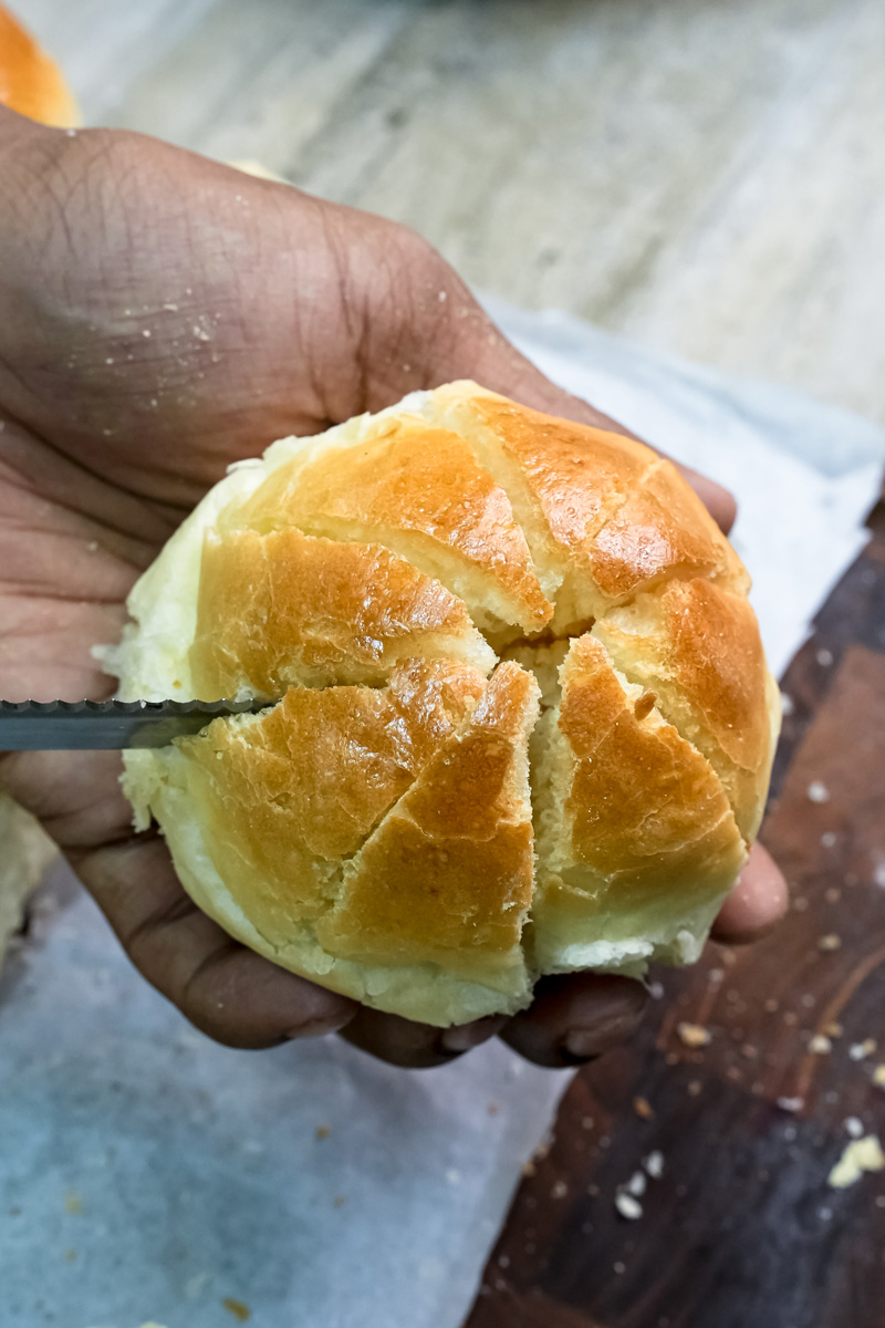 Korean bun with cross-hatch pattern held in hand