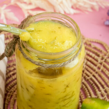 Lemon curd on spoon showing thick creamy consistency