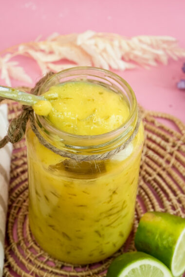 Lemon curd on spoon showing thick creamy consistency