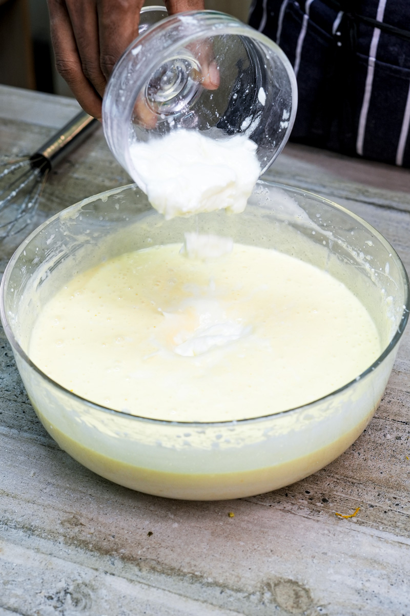 Making churro cake cream filling in glass mixing bowl