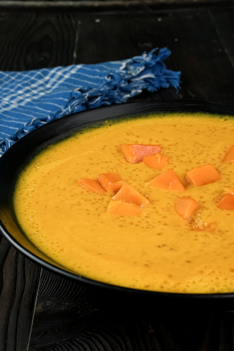 Mango sago dessert with fresh mango pieces on top