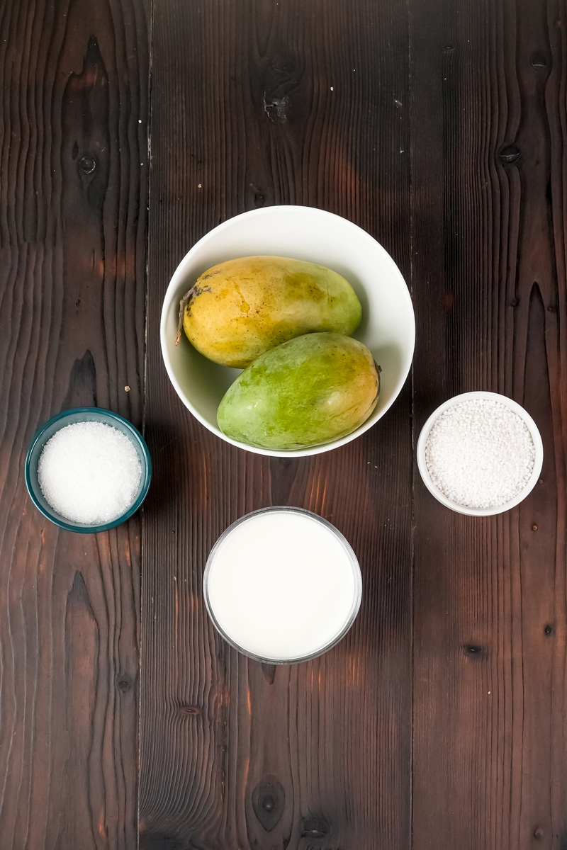 Mango sago ingredients - fresh mangoes, milk, sugar, and coconut