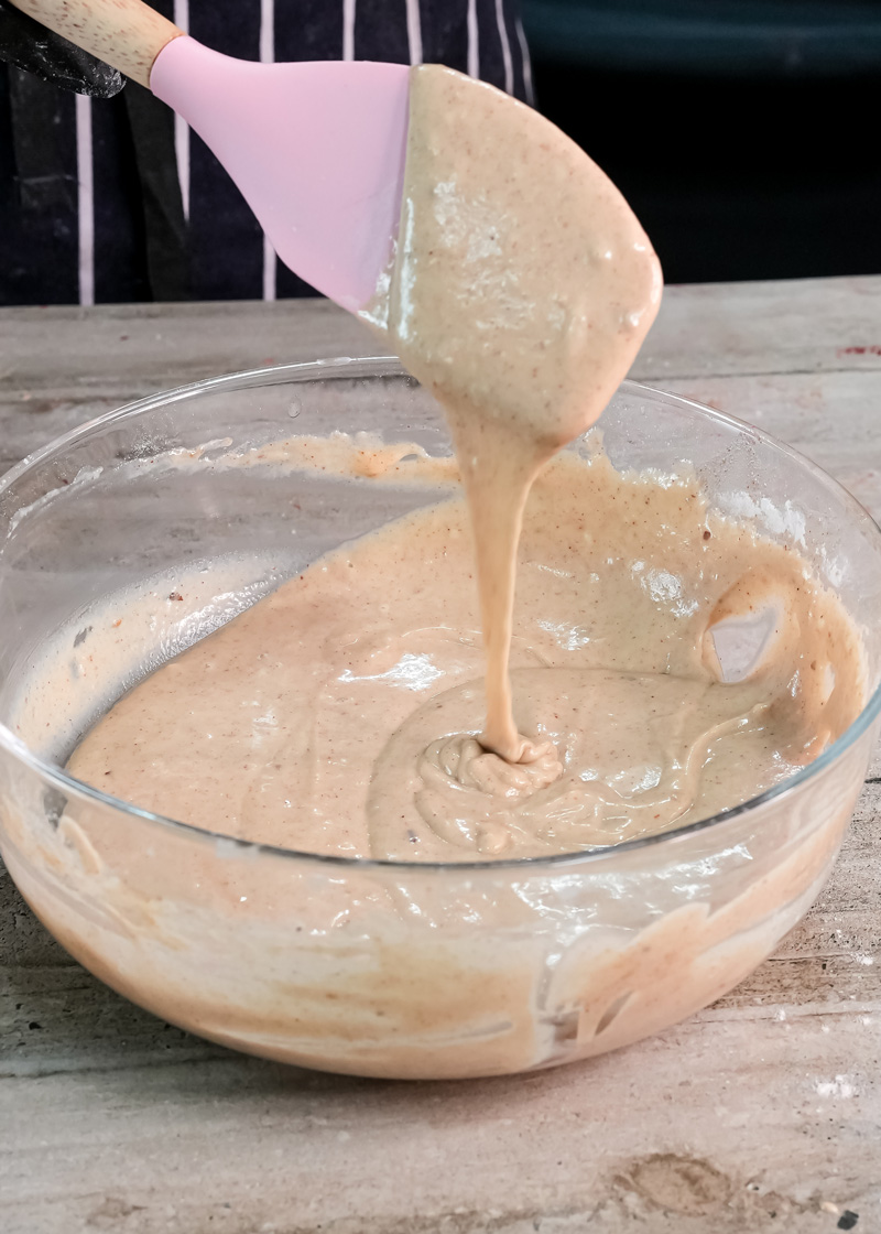 Mixing peanut butter pancake batter with silicone spatula