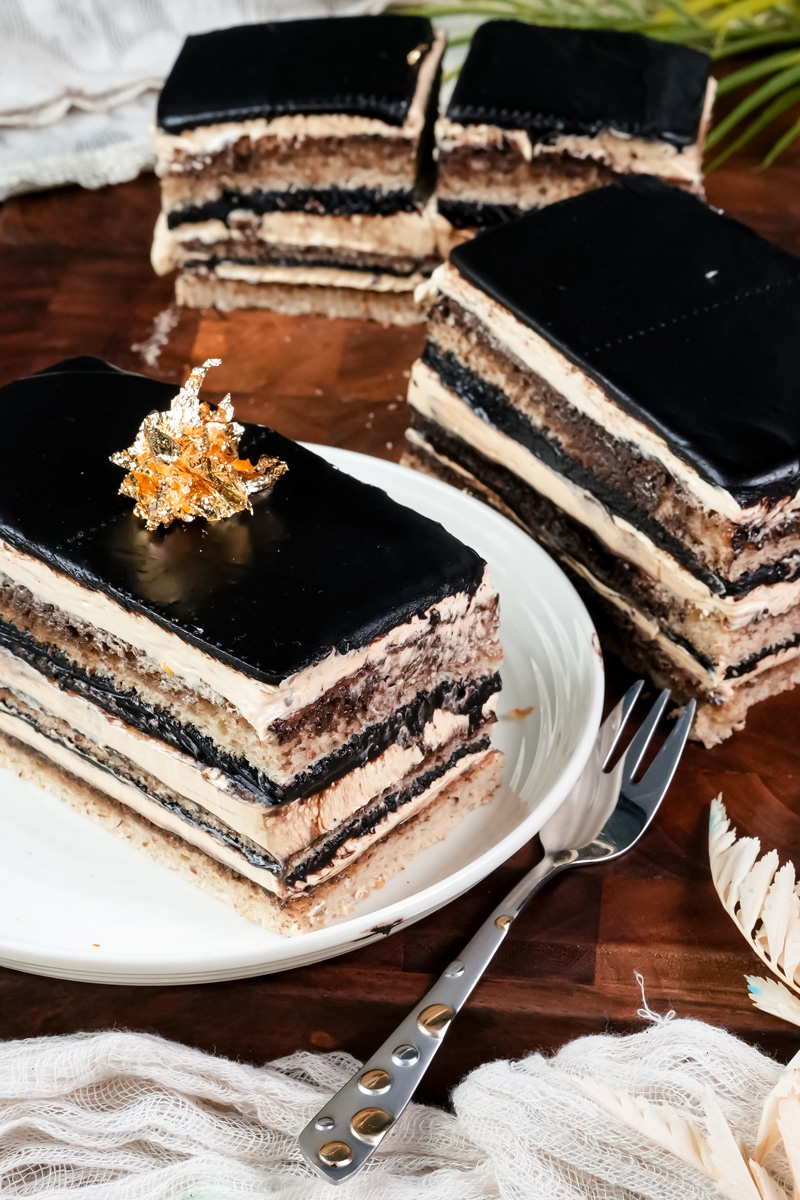 Multiple opera cake slices displaying perfect layered structure