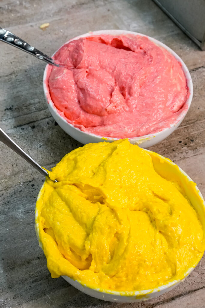 Pink and yellow Battenberg cake batter ready for baking
