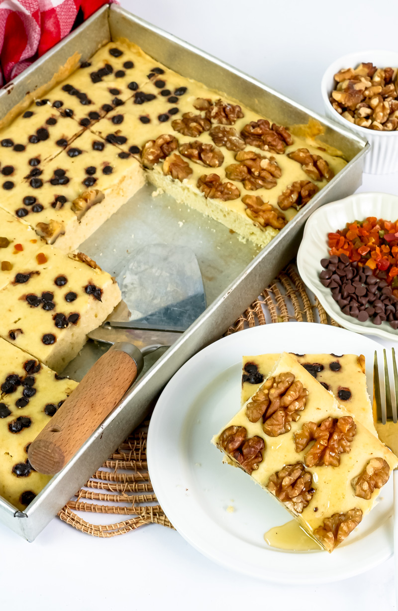 Sheet pan pancake serving with nuts and dried fruit