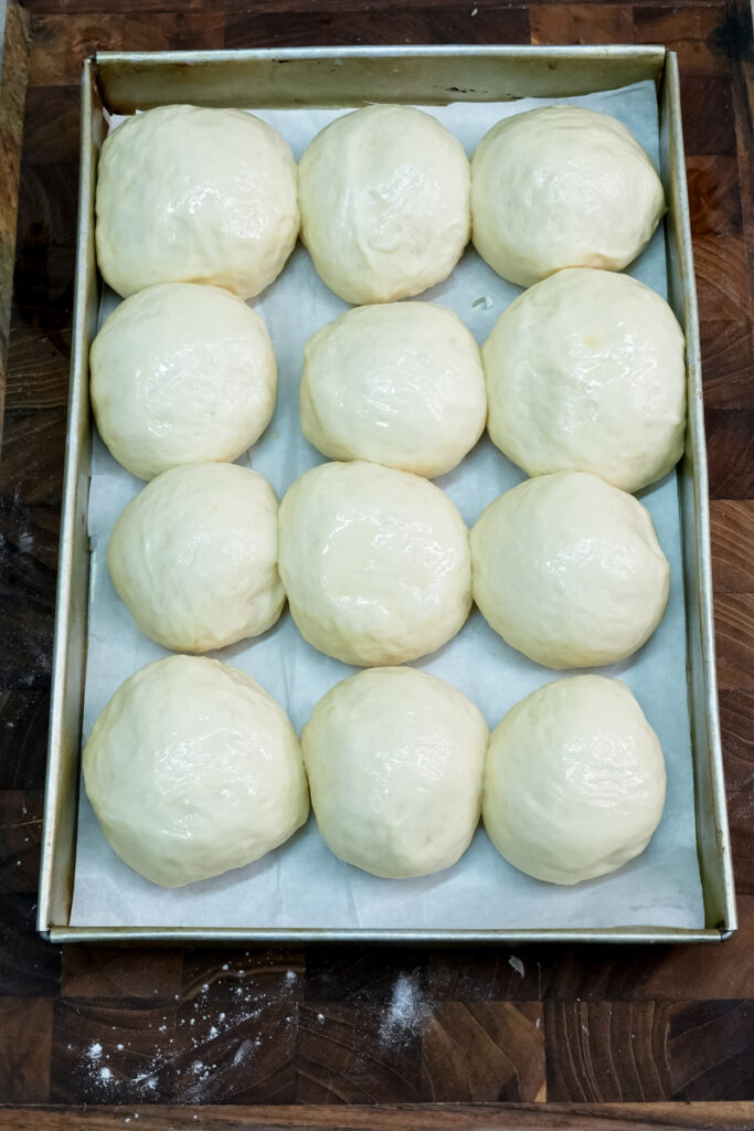 Raw Korean buns shaped and ready for baking