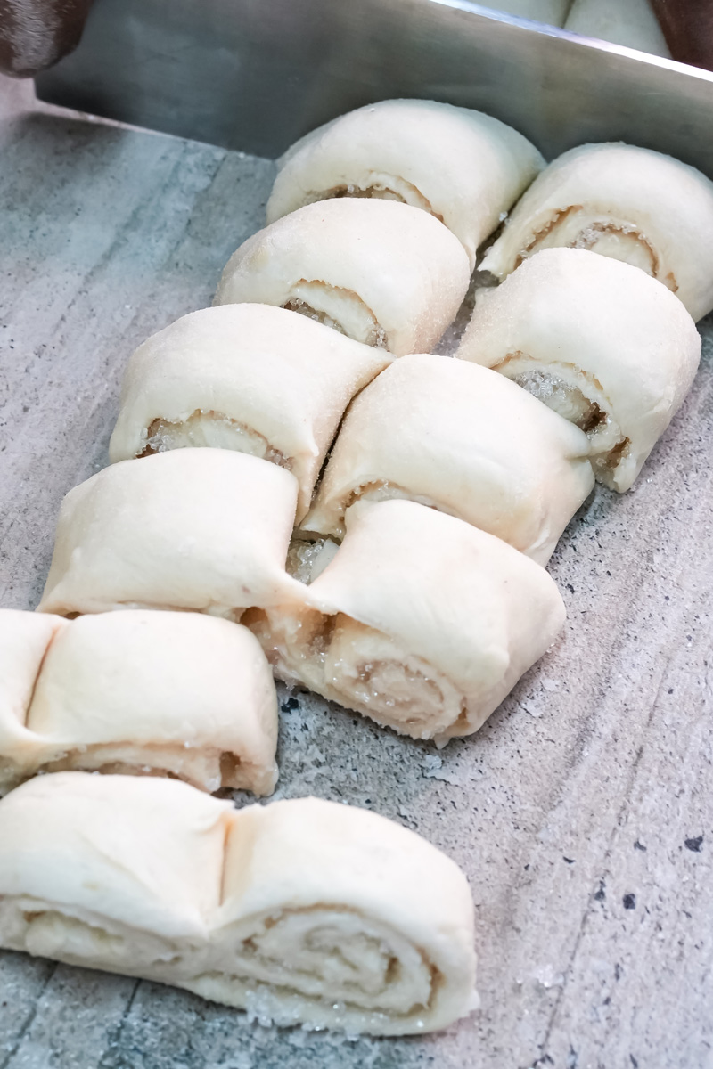 Raw palmiers arranged on parchment-lined baking sheet