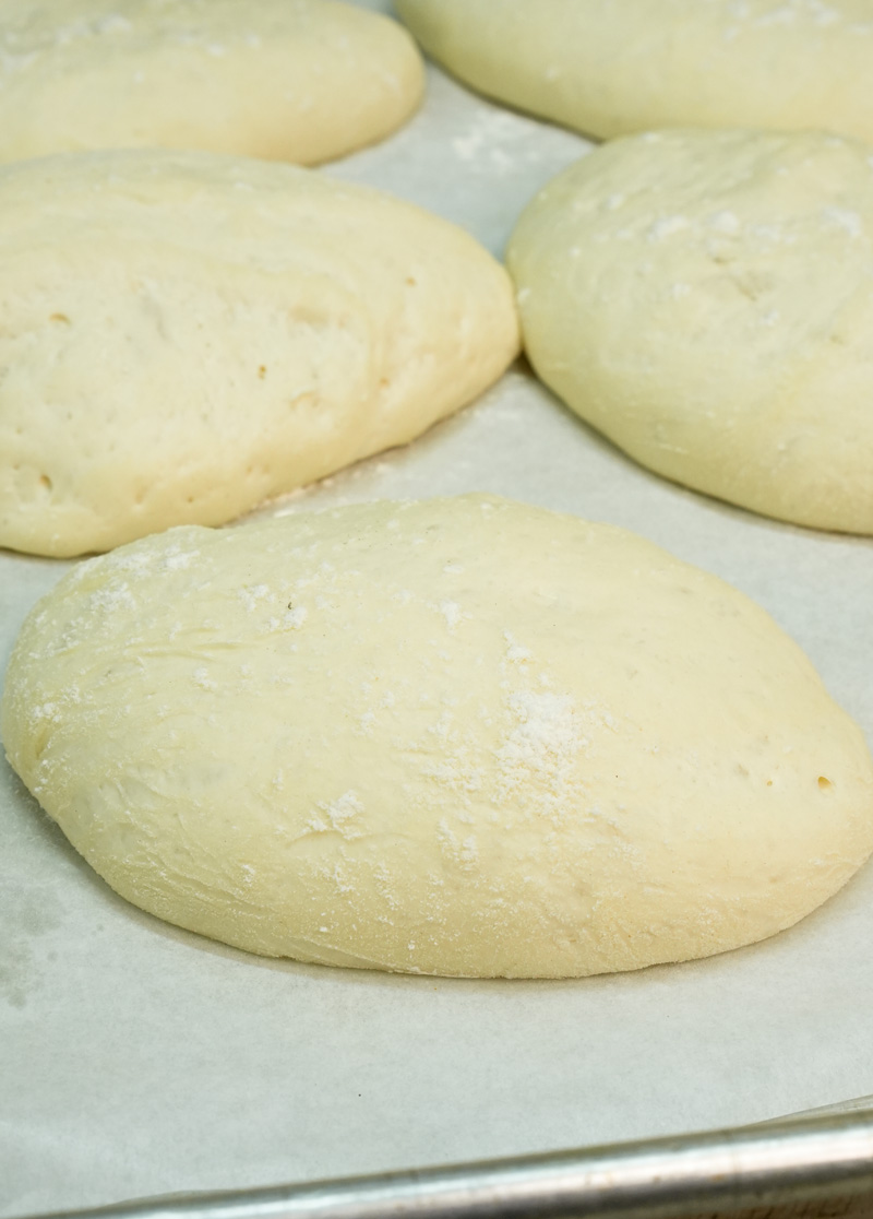 Risen ciabatta bread loaves before baking