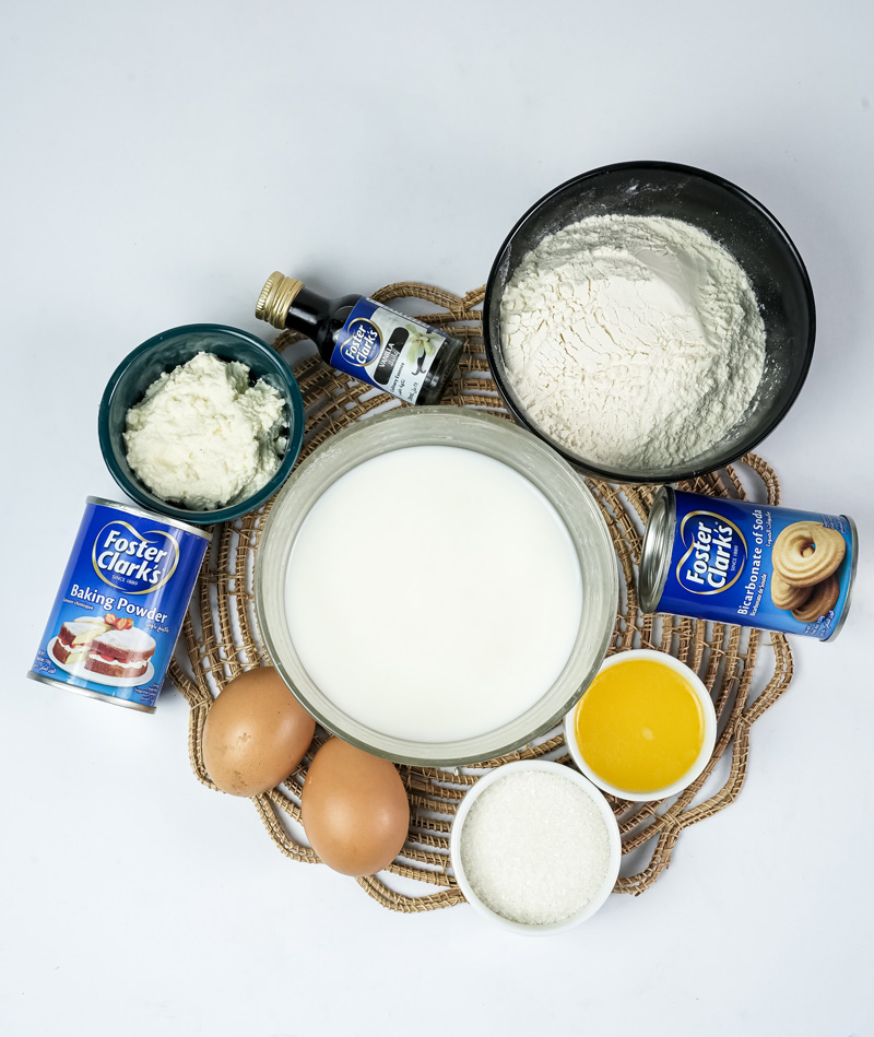 Sheet pan pancake ingredients including flour, milk, eggs, and baking powder