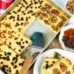 Plated sheet pan pancake slice with walnut and berry toppings