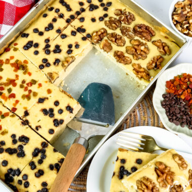 Plated sheet pan pancake slice with walnut and berry toppings