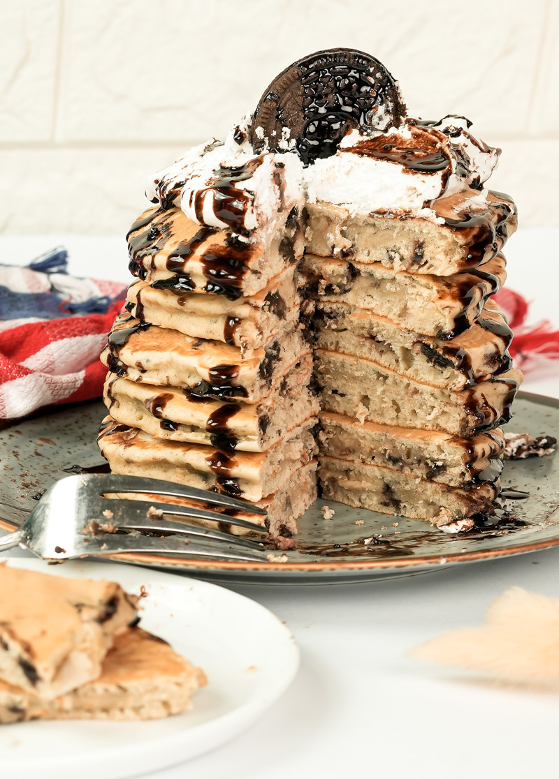 Sliced Oreo pancake stack showing internal cookie pieces and layers