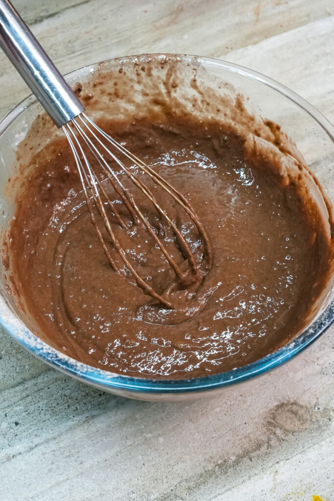 Smooth chocolate cake batter ready for baking
