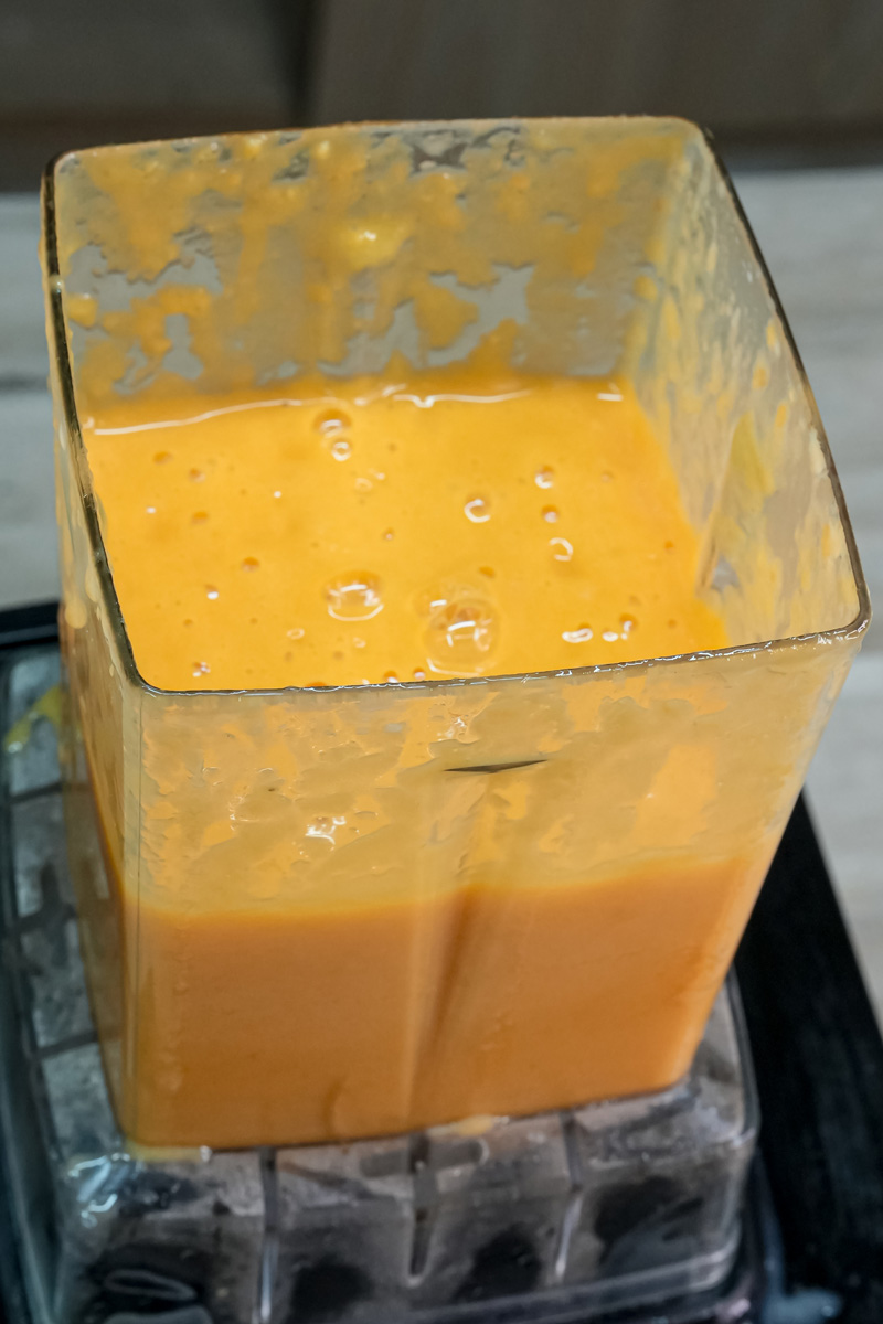 Smooth mango milkshake mixture ready in blender