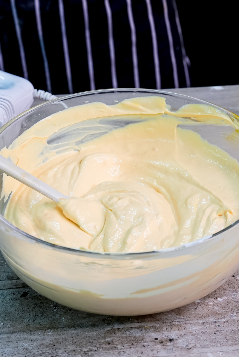 Smooth whipped custard cream ready for charlotte cake assembly