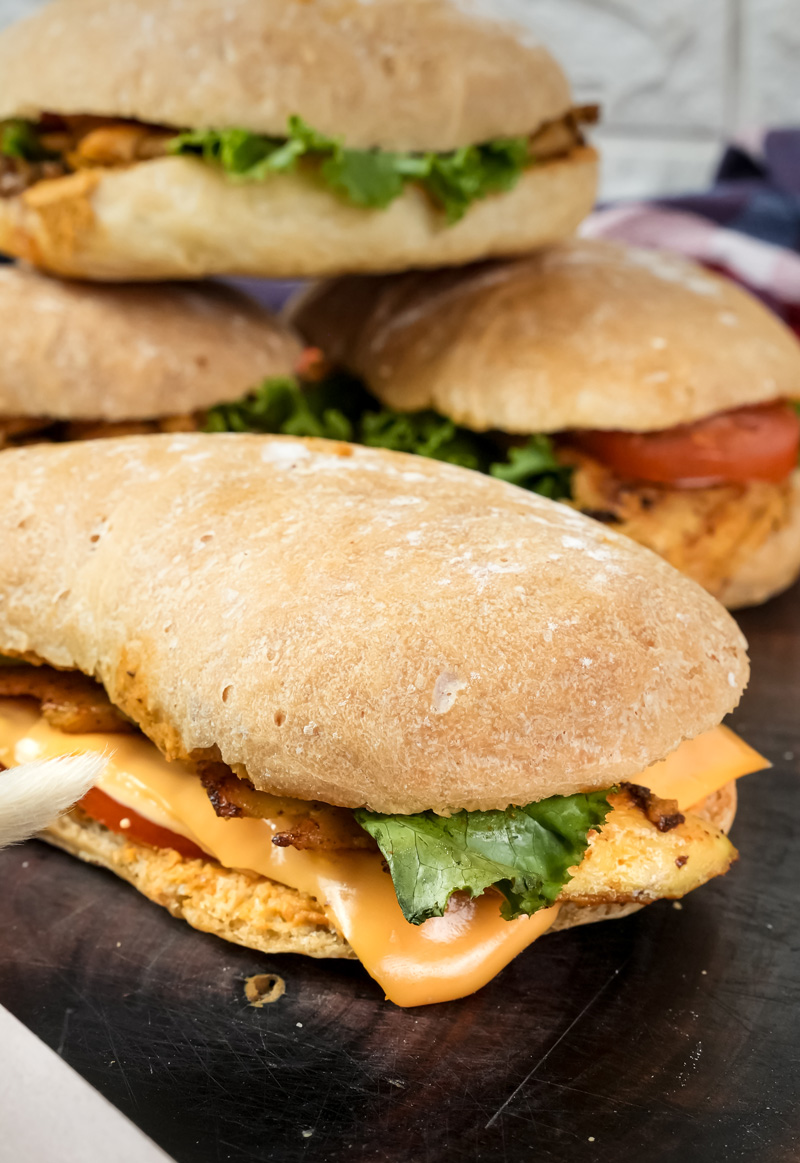 Stack of ciabatta sandwiches with various fillings
