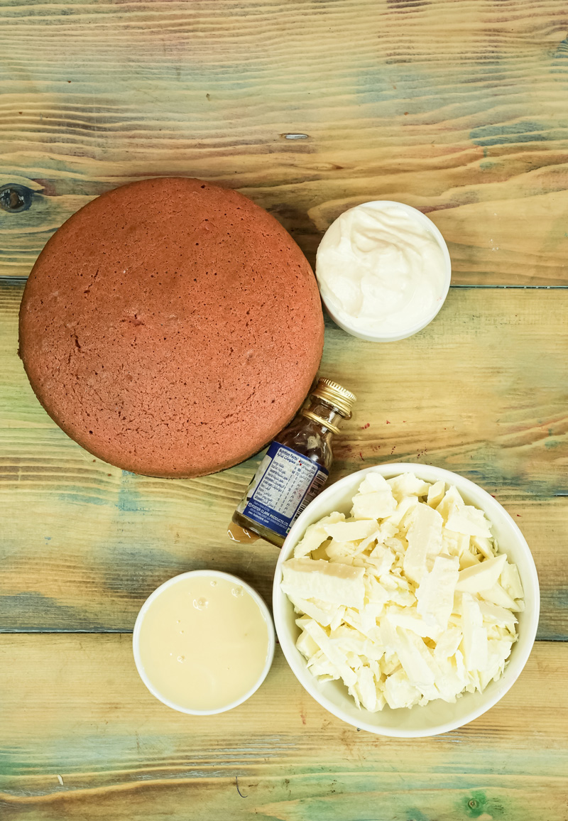 Strawberry cake pop ingredients - chocolate cake, frosting, melted chocolate, and cake crumbs