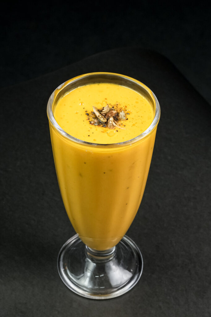 Traditional mango lassi drink with garnish