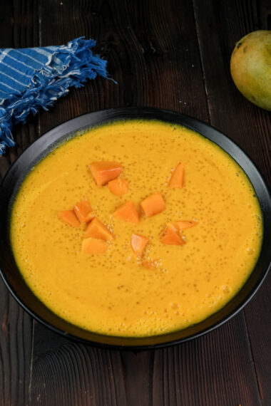 Traditional mango sago pudding with blue kitchen towel