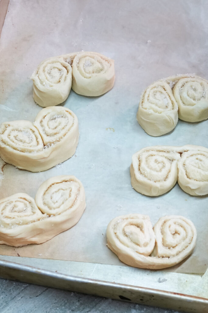 Unbaked palmiers on baking tray ready for oven