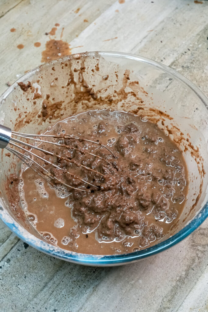 Whisking Ferrero Rocher cake batter until smooth
