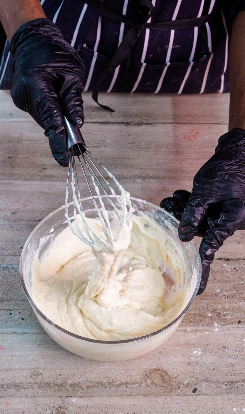 Whisking gluten free pancake batter until smooth with wire whisk