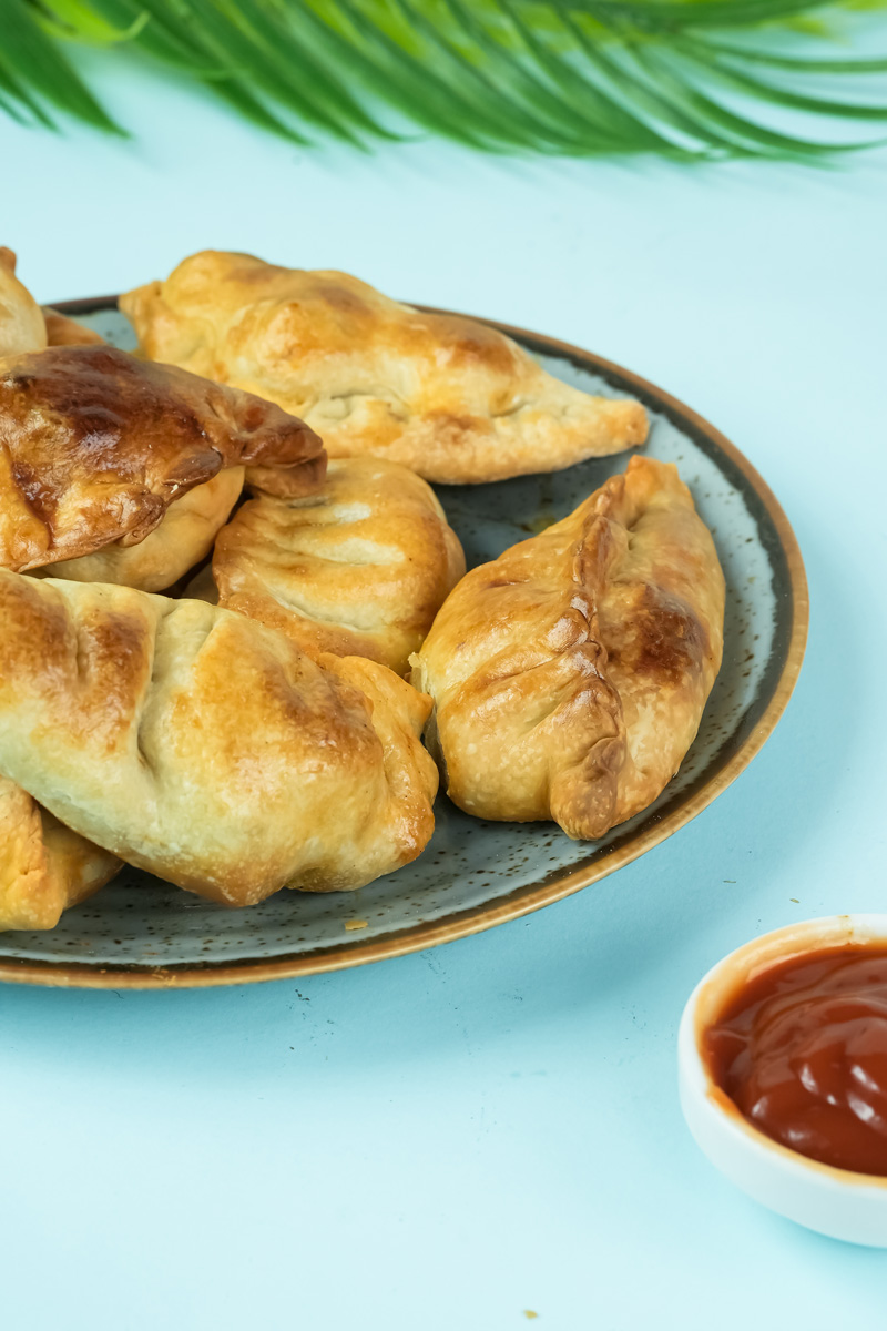 Freshly baked chicken empanadas with golden pastry crust