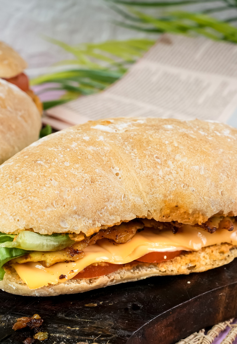 Cut ciabatta sandwich revealing interior fillings and bread texture
