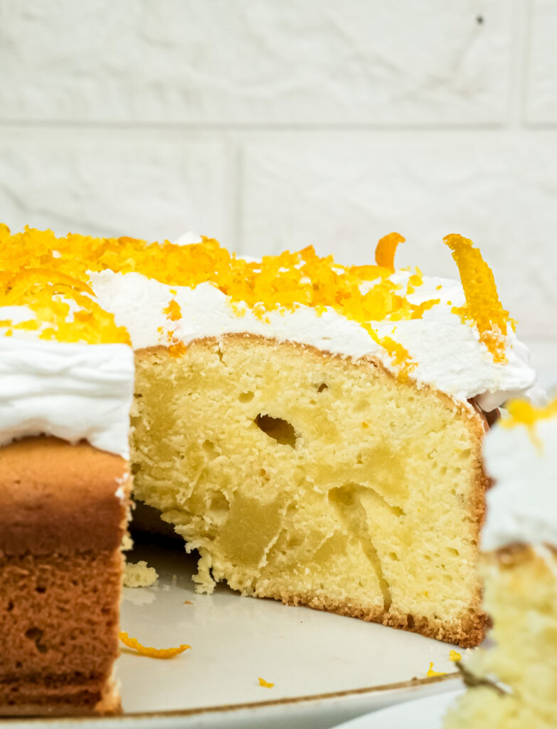 Close-up of citrus cake interior showing airy texture and holes