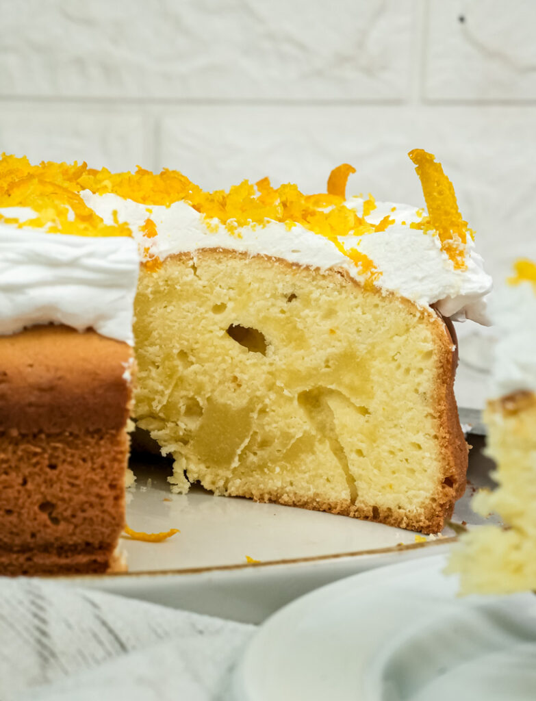 Detailed view of citrus cake slice highlighting fluffy cake texture