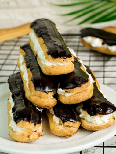 Final presentation of classic French eclairs with chocolate glaze and cream filling