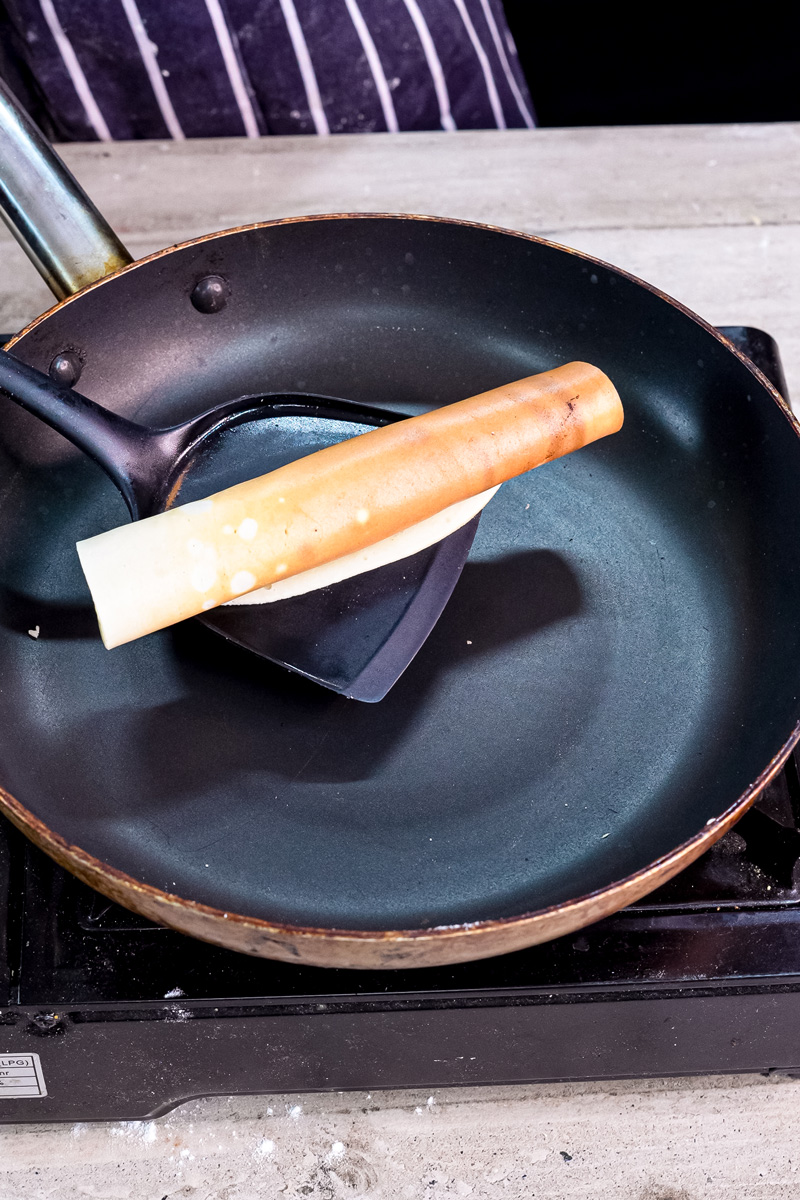 Perfectly cooked pancake roll ready to remove from pan