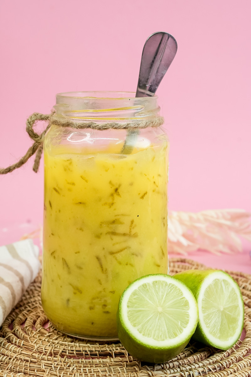 Thick creamy lemon curd in mason jar with rope decoration