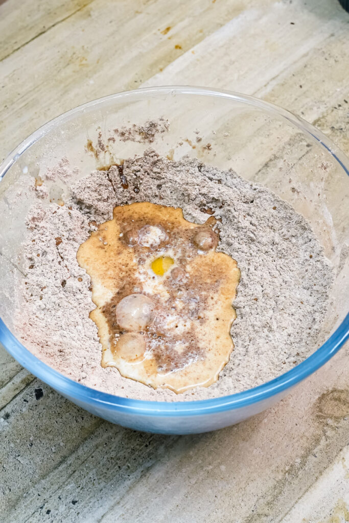 Adding wet ingredients to Ferrero Rocher cake mixture