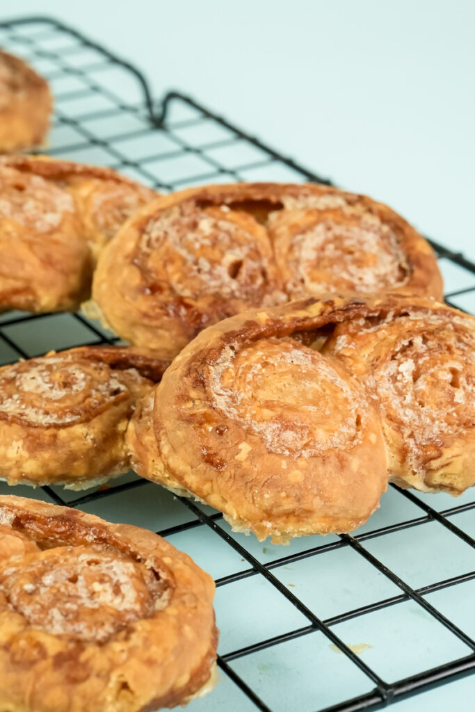 Close-up of golden palmiers with visible pastry layers