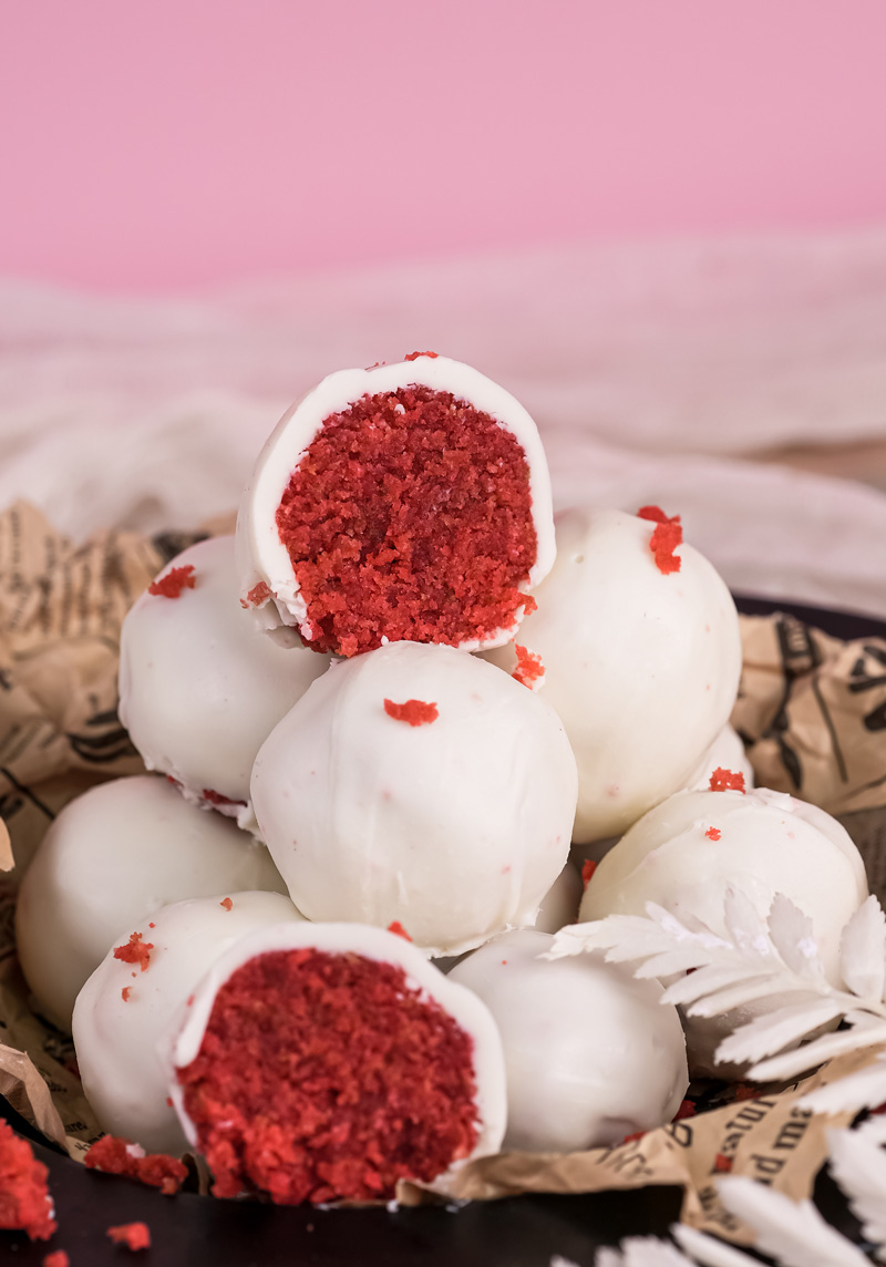 Final presentation of homemade strawberry cake pops with red crumb topping