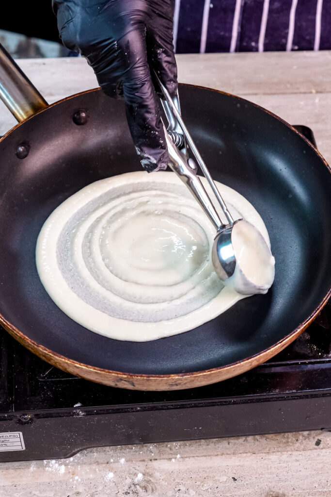 Creating spiral pattern while spreading pancake roll batter