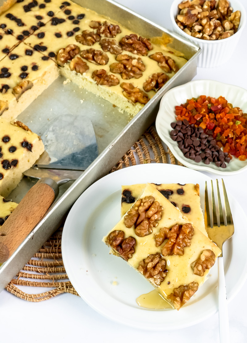 Individual portion of sheet pan pancakes with mixed toppings