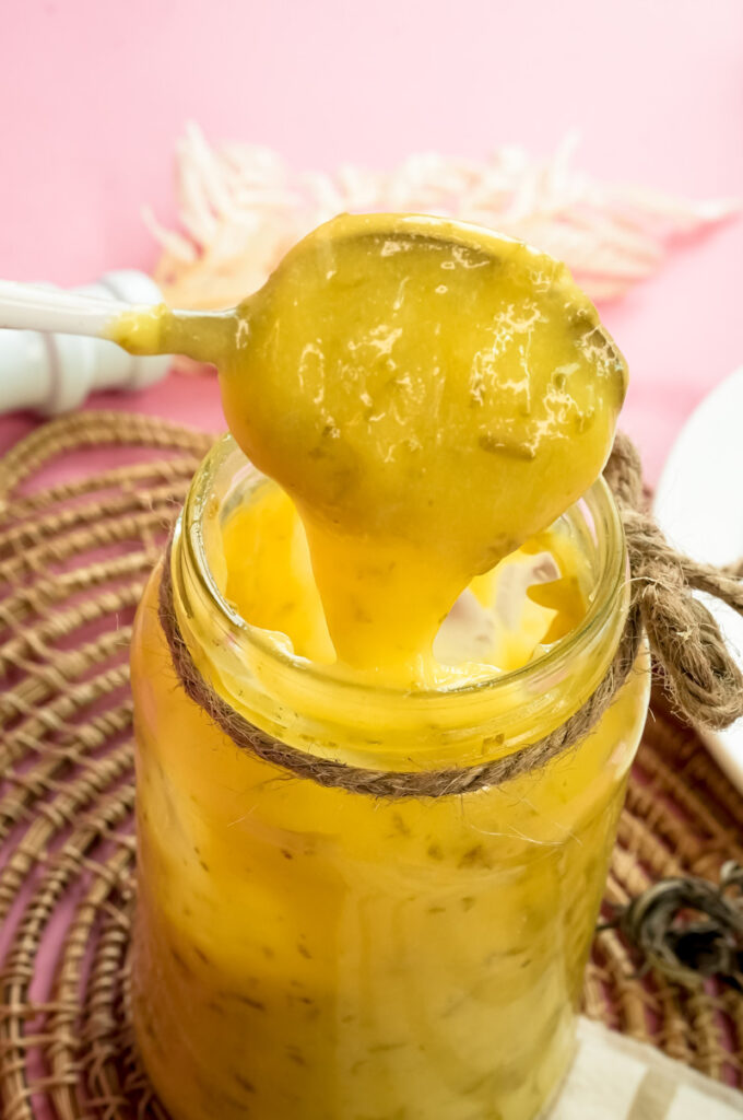 Close-up spoonful of thick homemade lemon curd
