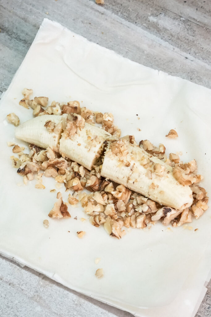Banana and walnut filling spread on parchment paper